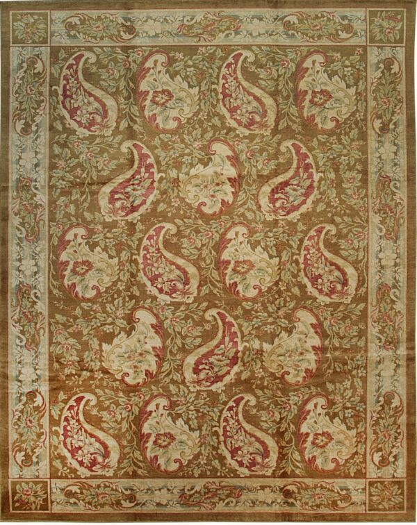 A rectangular rug with a dense pattern of large paisley motifs in rose, cream, and green on a brown field.