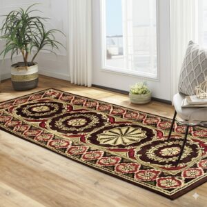 Maroon runner rug with detailed red and gold traditional medallions on light wood floor.