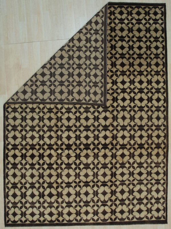 Brown and tan geometric rug on light wood floor with the top left corner folded over.