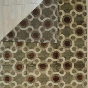 Modern olive rug featuring brown, tan, and cream interlocking geometric circles on a light wood floor.