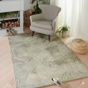 Off-white rug with dark linear geometric patterns sits beneath a gray armchair on light wood flooring.
