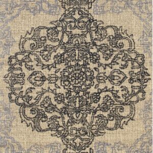 Textured rug detail showing a dark ornate medallion against a light beige and light gray background.
