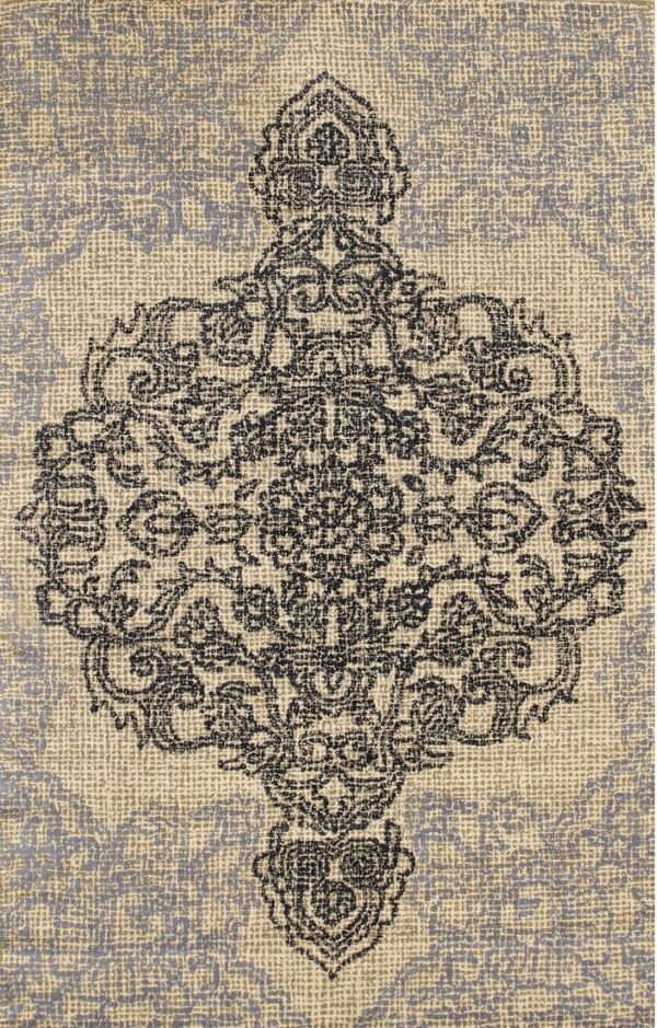 Textured rug detail showing a dark ornate medallion against a light beige and light gray background.