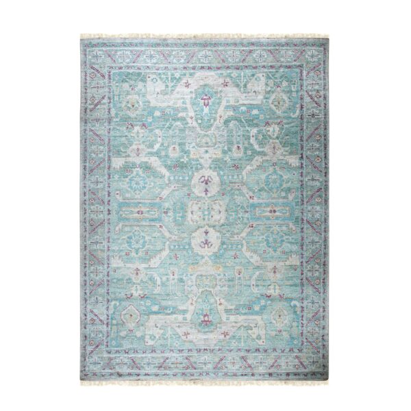 Muted teal, cream, and magenta traditional rug with a central medallion and detailed borders.