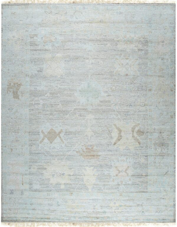 Light blue and gray low-pile rug with an abrash finish and a subtly faded traditional pattern.