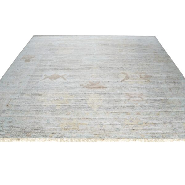 Silver and gray rug featuring a ribbed low-pile surface texture and faint beige ornamental patterns.