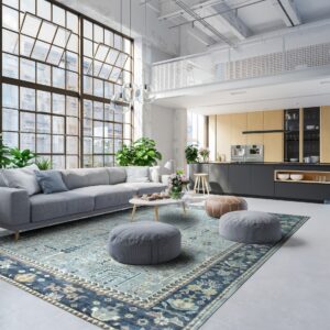 Distressed teal and navy traditional rug anchors a modern loft space with a gray sectional sofa.