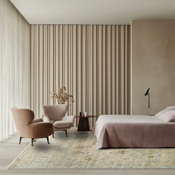 Low-pile beige and blue patterned rug covers light wood floors in a contemporary neutral bedroom setting.