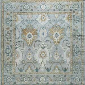 Traditional gray rug with ornate borders and patterns in gold, teal, and off-white.