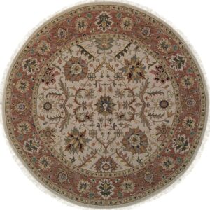 A round rug featuring a traditional floral medallion pattern in beige, rust, olive green, and gold colors.