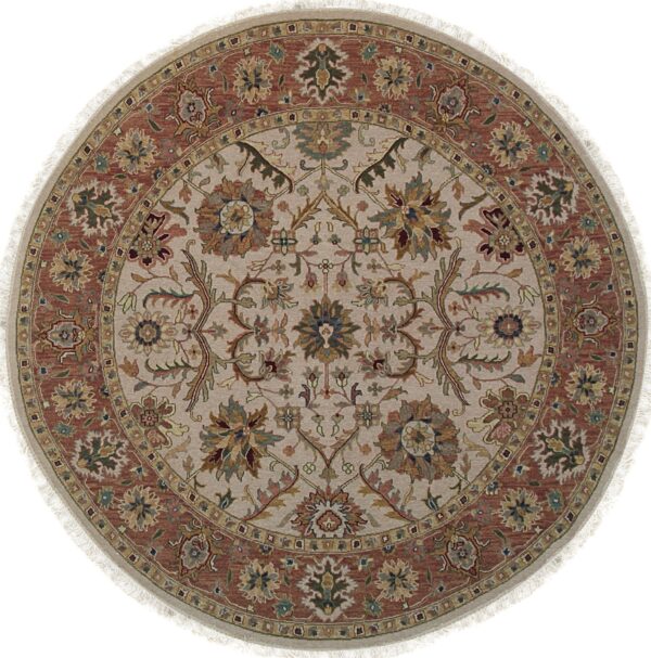 A round rug featuring a traditional floral medallion pattern in beige, rust, olive green, and gold colors.
