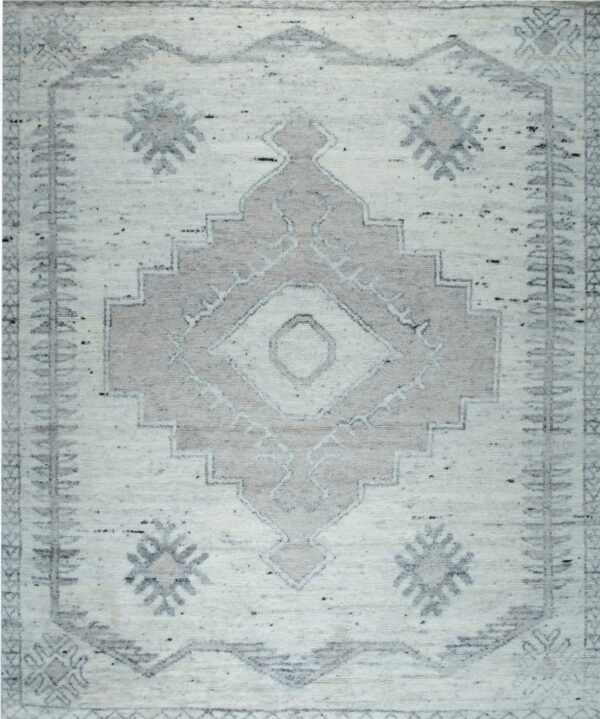 High pile rug with a geometric diamond pattern and tribal border in cream and gray tones.