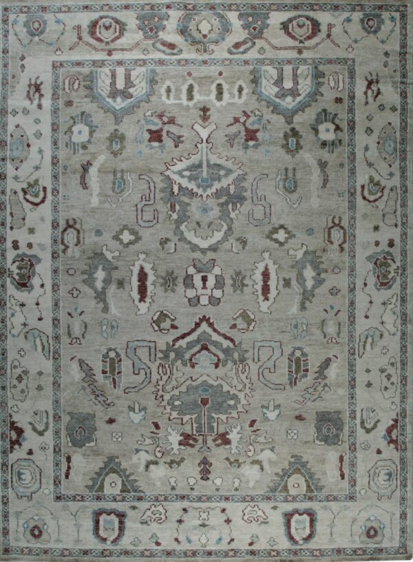 Muted gray and taupe rug with a complex, traditional medallion and border pattern.