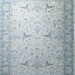 An off-white traditional rug with complex blue and beige floral medallions and fringe ends.