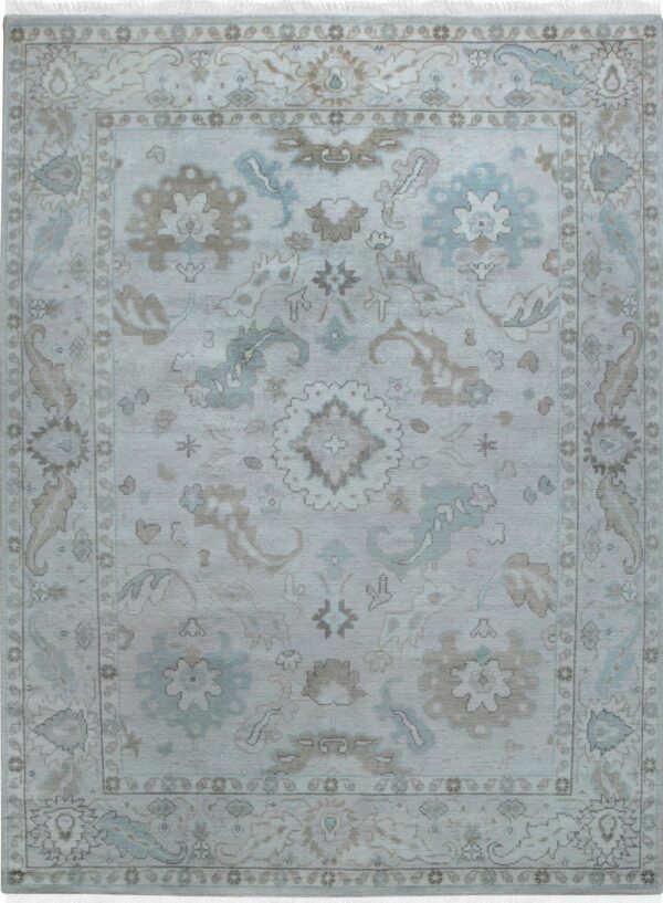 Light blue and grey-taupe traditional rug with a central medallion and distressed appearance.