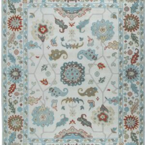 Off-white rug with a traditional floral pattern in light blue, tan, and muted red colors.