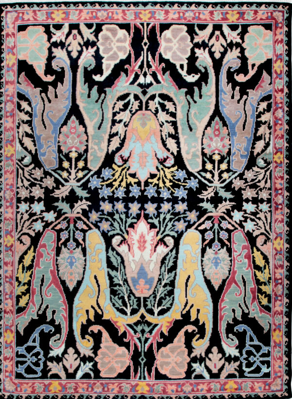 Intricate black rug featuring symmetrical palmettes and stylized flowers in shades of pastel blue, pink, and taupe.