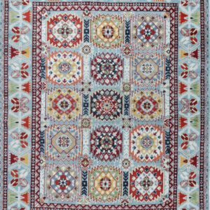 Light blue rug with a grid of twelve multicolored geometric medallions and complex, detailed borders.