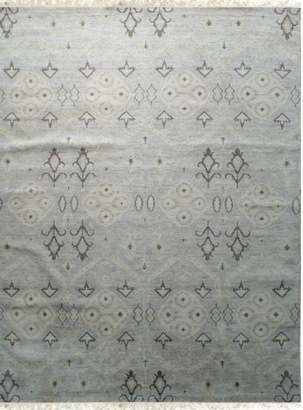 Lush traditional gray hand knotted wool rug 1 A muted blue-gray rug with repeating stylized floral and geometric motifs in taupe and light beige.