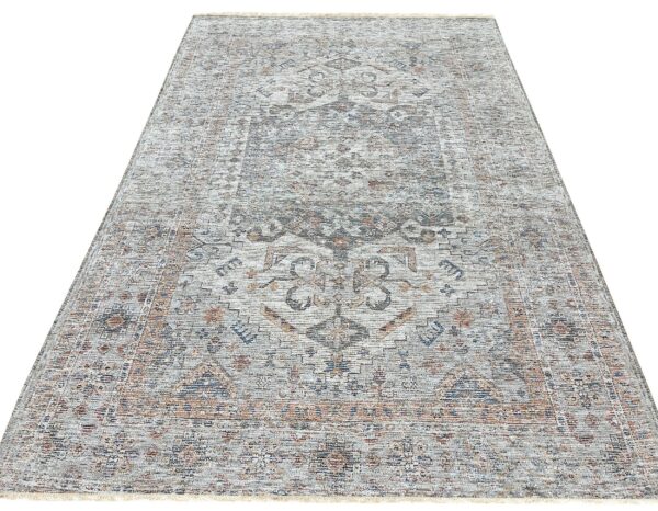 Distressed rectangular rug featuring a traditional medallion pattern in muted gray, rust, and blue tones.