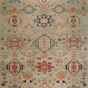 A distressed sage-colored rug featuring colorful traditional geometric medallions and scattered symbols in red, blue, and orange.