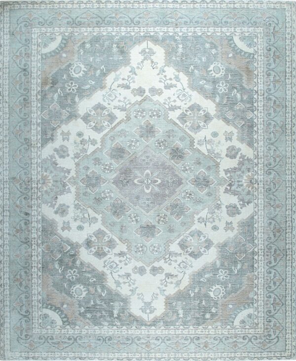Ornate traditional rug with a central diamond medallion, displaying distressed pale blue, gray, and white tones.