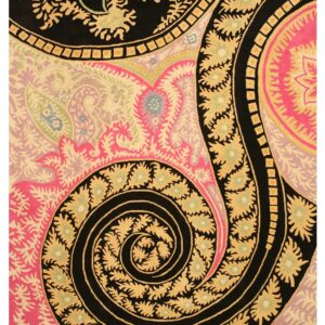 High-contrast rug pattern featuring black, pink, gold, and light green colors in large swirling paisley motifs.