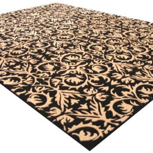 Ornate black and beige rug with a carved, high-low scrolling floral pattern, isolated on white.