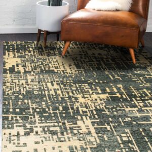 Abstract green and cream rug anchors a sunlit room with a brown leather armchair and potted houseplant.