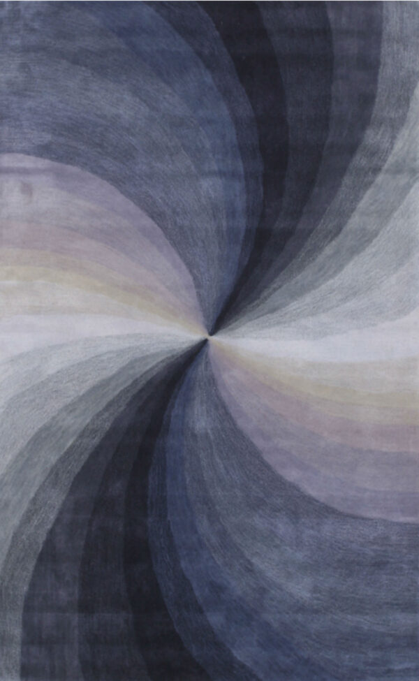 Radial gradient rug pattern in swirling bands of deep blue, various grays, white, and pale colors.