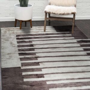 High-pile rug in dark taupe and off-white with a keyboard pattern on dark wood floors.