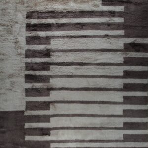 A high-pile rug features an abstract staggered geometric pattern using light grey and dark brown colors.