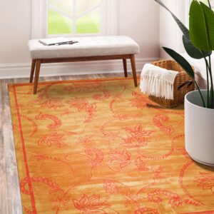 Orange and red botanical rug under a bench in a brightly lit room with wood floors.