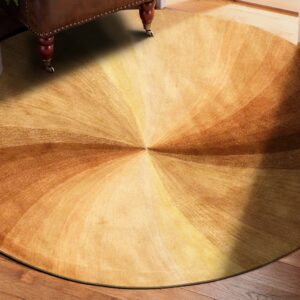 Circular rug in shades of brown and gold displays a radial pattern on hardwood near leather furniture.