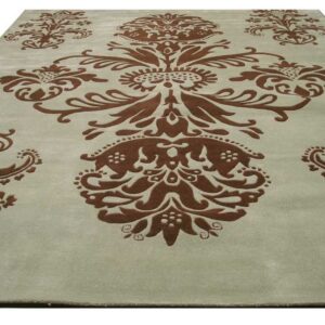 Pale greenish-gray rug with a large, raised brown traditional damask pattern.