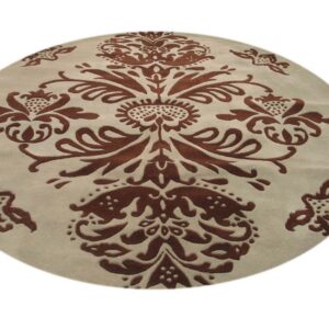 Circular rug with a high-low texture showing a central brown floral motif on beige.