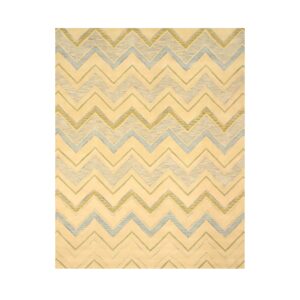 Cream rug displays a repeating zigzag pattern outlined in light blue and muted green stripes.