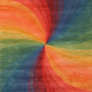 The rug displays a colorful vortex design blending red, orange, yellow, green, and blue bands.