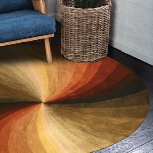 A round gold and orange radiating rug sits on dark wood floors near a blue chair and wicker basket.