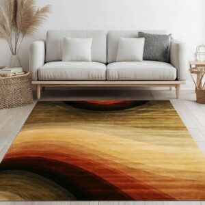 A rug featuring abstract dark brown, rust, and gold bands sits before a modern light-colored sofa.