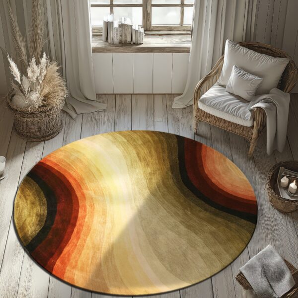 Abstract round rug in shades of orange, gold, maroon, and sage green sits on pale wooden floorboards.