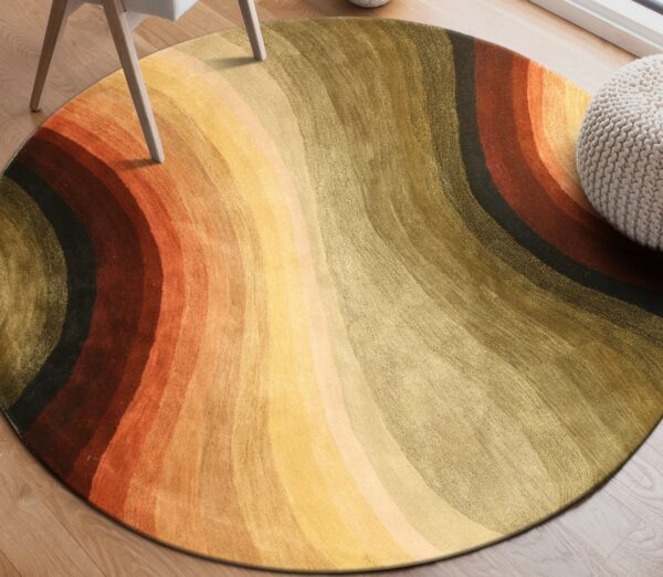 Round, textured rug with wavy orange, yellow, and olive stripes on light wood flooring.