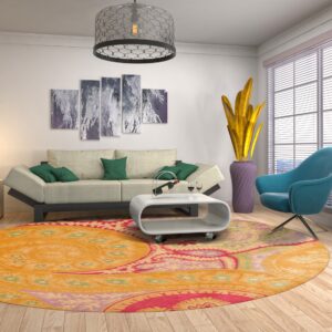 A vibrant orange, pink, and green circular rug grounds a modern living room with a sofa and turquoise chair.