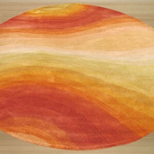 Circular rug with wavy abstract bands of red, orange, and golden yellow colors on light wood flooring.