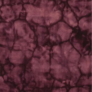 A burgundy rug with a soft texture displays an abstract pattern resembling dark-veined cracked earth.