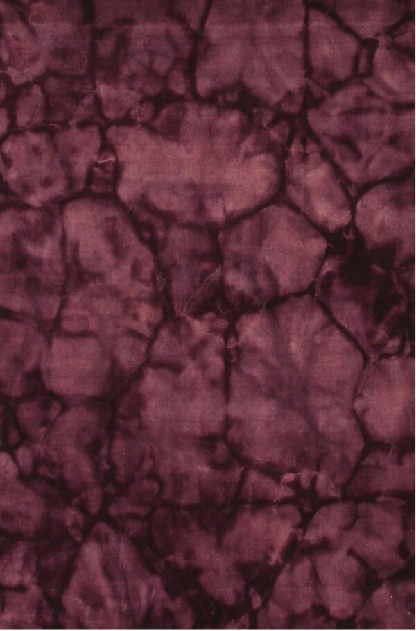 A burgundy rug with a soft texture displays an abstract pattern resembling dark-veined cracked earth.