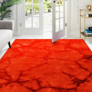 Bright red rug with dark, abstract, veined patterning sits on white flooring by open French doors.