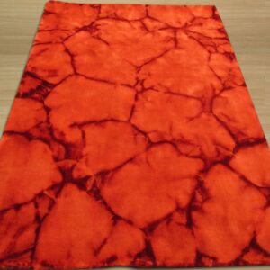 A rectangular rug in vermillion and dark red crackle pattern lies on light plank wood flooring.