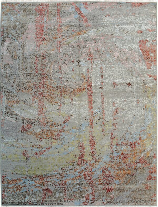 Gray abstract rug featuring distressed traditional motifs accented by red, rust, blue, and yellow colors.