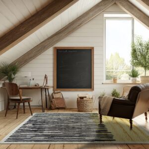 Textured rug with black stripes and golden-tan block accents lies on wood floors in a bright attic study.